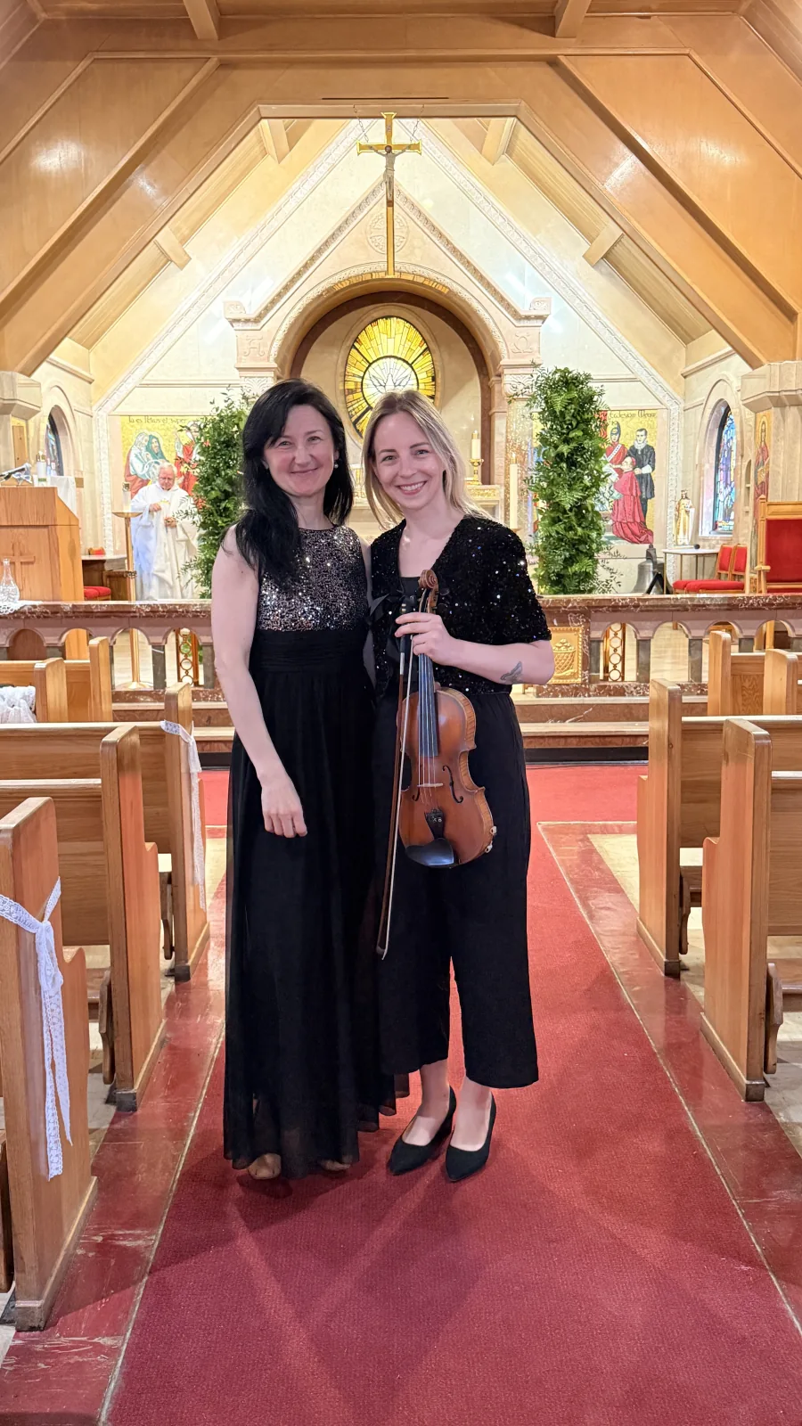 Marta and Daiga, violin and piano duo, before a wedding ceremony